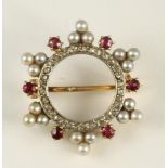 A LATE VICTORIAN CIRCLET BROOCH, the inner border pave set with small rose cut diamonds within six