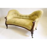 A VICTORIAN WALNUT FRAMED THREE SEATER SOFA of double spoon back form button upholstered in yellow
