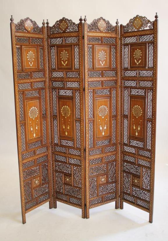 AN INDIAN HARDWOOD FOLDING ROOM SCREEN, c.1900, of four fold pierced trellis form interspersed