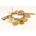 A VICTORIAN 9CT GOLD HOLLOW CURB LINK CHAIN BRACELET, with foliate engraved alternating pairs of