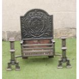 A CAST IRON FIRE GRATE of Georgian design, arched back with armorial in low relief, barred