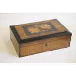 A VICTORIAN WALNUT AND EBONISED TABLE BOX of oblong form, the hinged lid with oblong serpentine