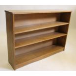 AN ADZED OAK OPEN BOOKCASE by Colin Almack "Beaverman", of oblong form with two fixed shelves,