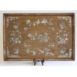 A CHINESE HARDWOOD TRAY, 19th century, of plain oblong form, inlaid with mother of pearl with a