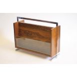 A ROSEWOOD VENEERED AND CHROME MAGAZINE RACK by Richard Young, Merrow Associates, of oblong form