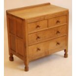 AN ADZED OAK CHEST by Robert "Mouseman" Thompson, the moulded edged top with ledge back, two short