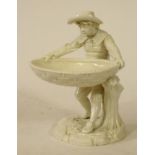 A ROYAL WORCESTER PARIAN FIGURAL SWEETMEAT, modelled by James Hadley as a young boy wearing a wide