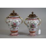 TWO GRADUATED CHINESE EXPORT PORCELAIN GARNITURE VASES, 18th century, of inverted baluster form with