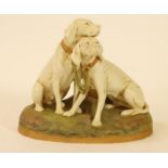 A ROYAL DUX PORCELAIN MODEL, early 20th century, of two hunting dogs, their collars tied by a