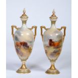 A PAIR OF ROYAL WORCESTER CHINA VASES AND COVERS, 1910, of slender ovoid form with garlic necks