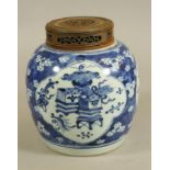 A CHINESE PORCELAIN GINGER JAR, 19th century, painted in underglaze blue with three quatrefoil