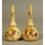 A MATCHED PAIR OF ROYAL WORCESTER CHINA BUD VASES, 1903/5, of rounded conical form with slender