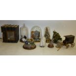 A collection of various small room and other displays, some under glass domes, incorporating dolls