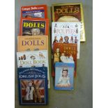 Nine volumes of books on dolls, most with dust covers