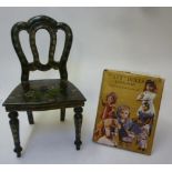 A doll's carved wood and ebonised single chair with painted flower decoration, 18" high, eight