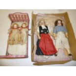 A pair of bisque head dolls house dolls with fixed brown glass eyes, mohair wigs, composition bodies