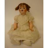 A Catterfelder Puppenfabrik bisque head character doll with brown glass sleeping eyes, open mouth