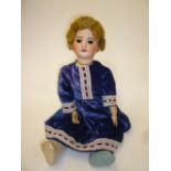 An S.F.B.J. bisque head doll with brown glass sleeping eyes, open mouth and teeth, blonde mohair