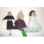 A bisque shoulder head dolls house doll with painted face, blonde mohair wig, bisque arms and