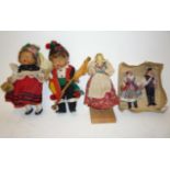 A pair of Continental composition costume dolls with felt outfits, the boy with bagpipes, the girl