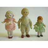 An all bisque girl doll with star fish hands, 4 3/4" high, another all bisque doll, 5" high, both