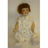 An Edmund Edelmann "Melitta" bisque head character doll with brown glass sleeping eyes, open mouth