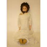 A Bahr and Proschild bisque shoulder head doll with brown glass sleeping eyes, open mouth and teeth,