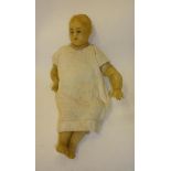 A wax shoulder head lay figure with blue intaglio eyes, moulded hair, stuffed fabric body, wax