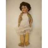 A J. Walther & Sohn bisque head doll with blue glass sleeping eyes, open mouth and teeth, brown