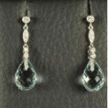 A PAIR OF AQUAMARINE PENDANT EARRINGS, the briolette cut stones peg set and hanging from two 18ct