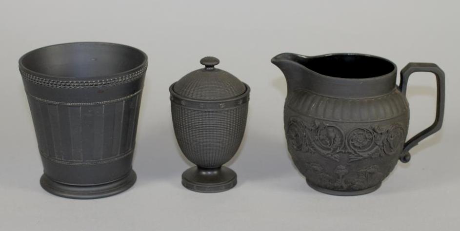 A WEDGWOOD BLACK BASALT CACHE-POT, early 20th century, of flared cylindrical form with engine turned