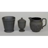 A WEDGWOOD BLACK BASALT CACHE-POT, early 20th century, of flared cylindrical form with engine turned