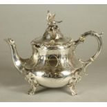 A VICTORIAN SILVER TEAPOT, maker Hyam Hyams, London 1856, of panelled baluster form, the hinged high