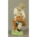 A DERBY PORCELAIN FIGURE, c.1770, allegorical of Autumn modelled as a young boy wearing a white open