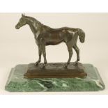 R WINDER, a bronze model of a standing horse, signed, raised on a moulded canted oblong base and
