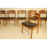 A SET OF EIGHT DANISH TEAK DINING CHAIRS, the tapering rounded uprights enclosing an arched curved