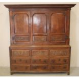 A GEORGE III OAK LIVERY CUPBOARD, 18th century, the moulded cornice and frieze over a pair of ogee