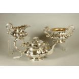 AN OLD SHEFFIELD PLATE THREE PIECE TEA SERVICE, early 19th century, of lobed squat globular form