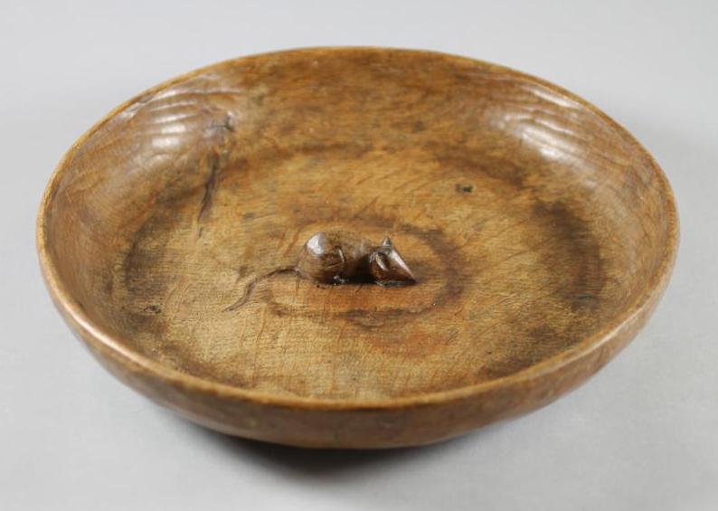 A ROBERT THOMPSON ADZED OAK FRUIT BOWL, of shallow circular form with central carved mouse trademark