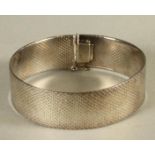 A SILVER FLEXIBLE CUFF, London 1976, 7 1/4" long, 39.3g