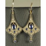 A PAIR OF ART DECO STYLE DROP EARRINGS, the fan shaped open panels pendant with an oval facet with