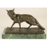 A BRONZE MODEL OF A FOX, c.1900, walking with its head turned and snarling, unsigned, raised on an