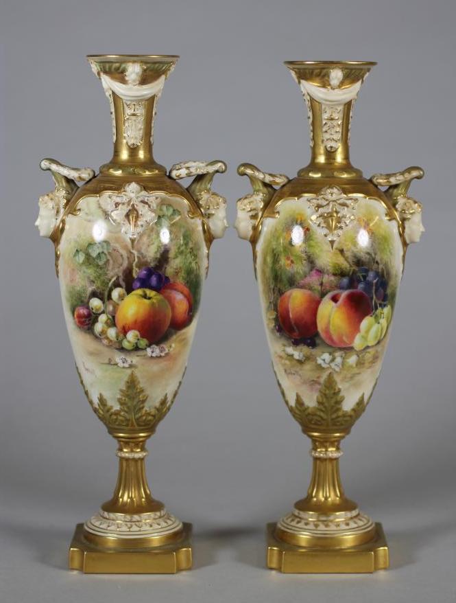 A MATCHED PAIR OF ROYAL WORCESTER CHINA VASES, 1912 and 1913, of slender ovoid form with arcade