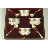 A SET OF FOUR LATE VICTORIAN SILVER SALTS, makers Minshull & Latimer, Birmingham 1898, of waisted