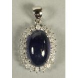 A SAPPHIRE AND DIAMOND PENDANT, the oval cabochon polished sapphire of approximately 11.4cts, claw