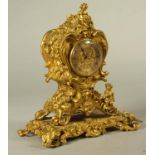 A LOUIS XV STYLE BOUDOIR CLOCK, the cylinder movement stamped Howell & James, Regent Street,