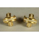 A PAIR OF TIFFANY & CO. DIAMOND SET 18CT GOLD STUD EARRINGS as domed reeded crosses point set with