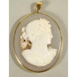 A VICTORIAN HARDSTONE CAMEO PENDANT, the oval pale grey shading to buff ground carved in high relief