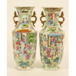 A PAIR OF CANTONESE PORCELAIN VASES, 19th century, of flared canted oblong form with two flat scroll