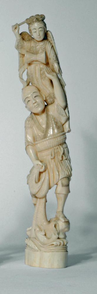 A JAPANESE ONE PIECE IVORY OKIMONO, Meiji period, of a fisherman supporting a young child standing
